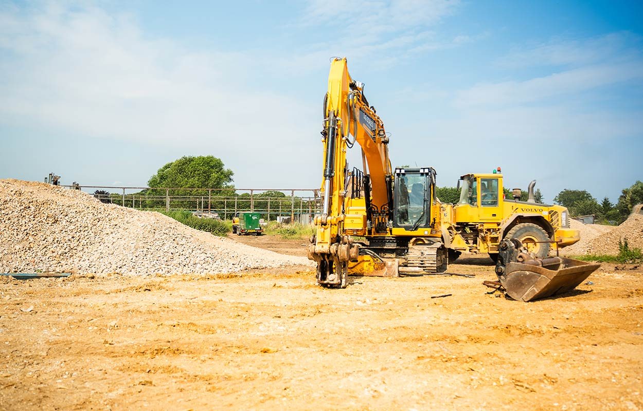 Excavator preparing ground on a development site